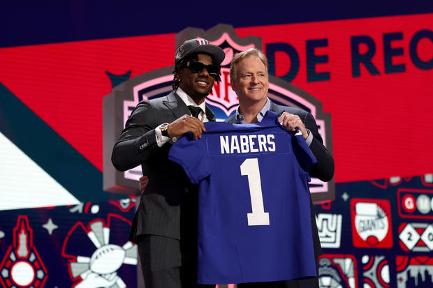 Malik Nabers poses with NFL Commissioner Roger Goodell after being selected sixth overall by the New York Giants during the first round of the 2024 NFL Draft at Campus Martius Park and Hart Plaza on April 25, 2024 in Detroit, Michigan. 