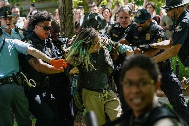 Police officers arrest a demonstrator during a protest against the war in Gaza at Emory University on April 25, 2024, in Atlanta, Georgia.