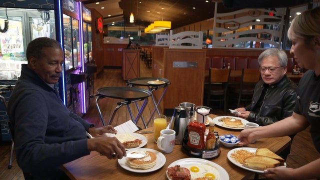 Bill Whitaker and Jensen Huang in a Denny's