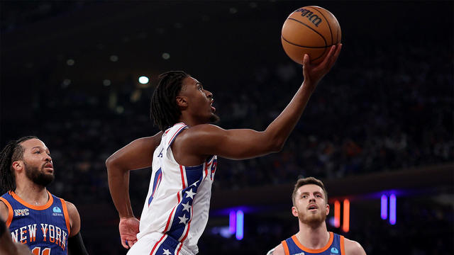Tyrese Maxey #0 of the Philadelphia 76ers heads for the net as Jalen Brunson #11 and Isaiah Hartenstein #55 of the New York Knicks defend during the first half at Madison Square Garden on April 30, 2024 in New York City. 