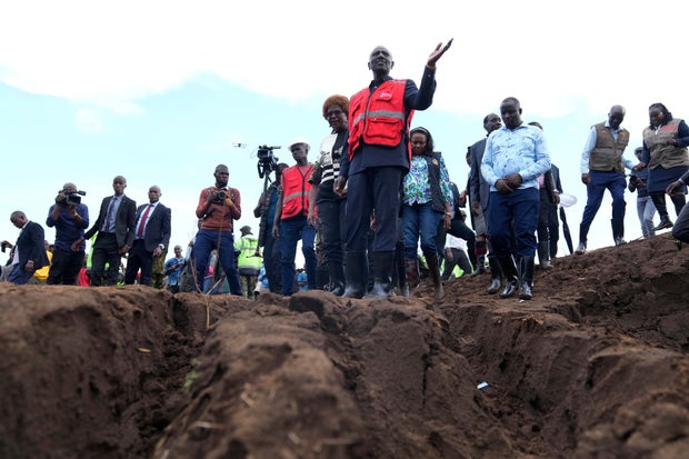 Kenyan President William Ruto gestures while visiting an area where floodwater washed away houses and people in Kamuchiri Village, Nakuru County, Kenya, April 30, 2024