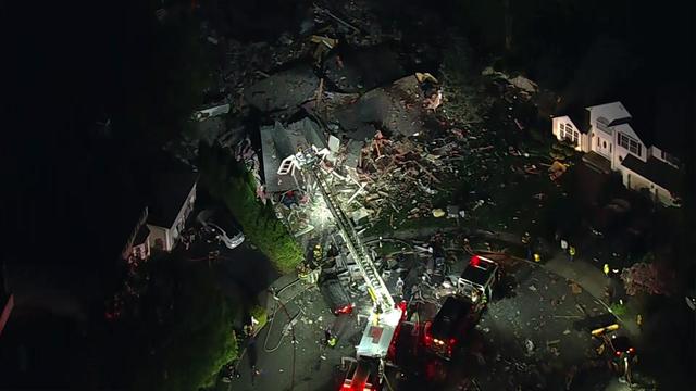 An aerial view of debris from an apparent house explosion. 