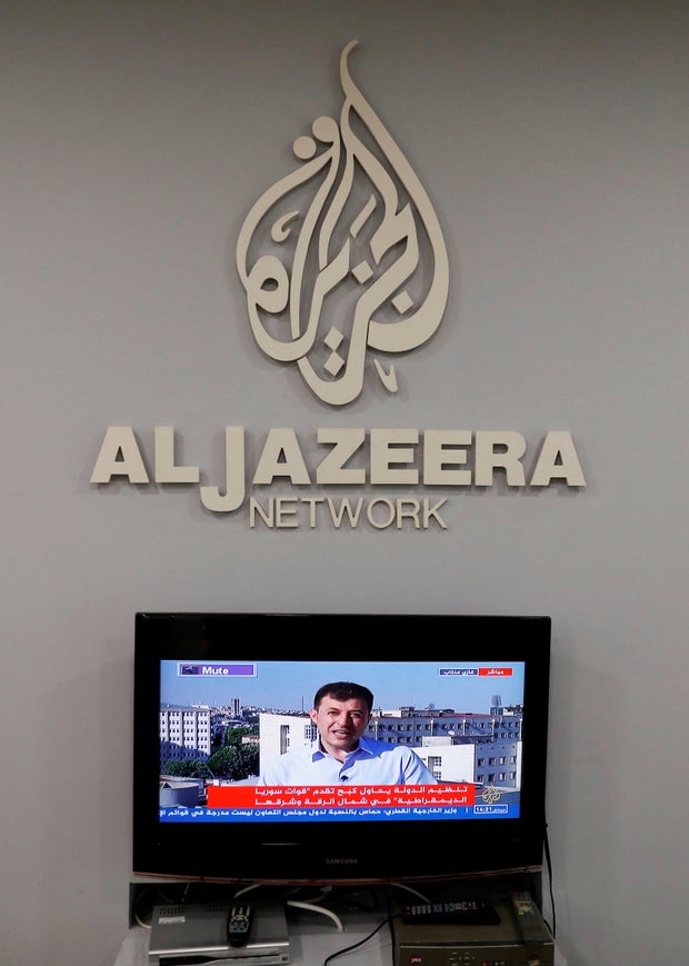 FILE PHOTO: The logo of Qatar-based Al-Jazeera network is seen in one of their offices in Jerusalem