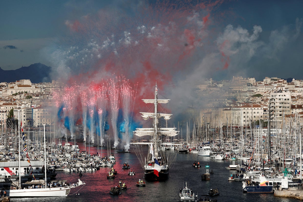 The Belem, a three-masted sailing ship carrying the Olympic flame, arrives at Marseille's Old Port in France ahead of the 2024 Paris Olympics, May 8, 2024. 