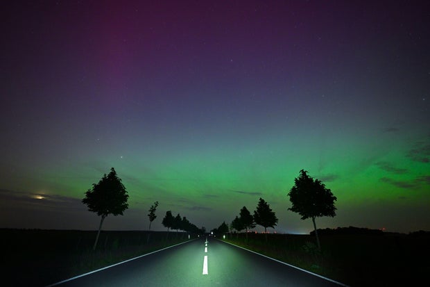 Northern lights shine in the night sky