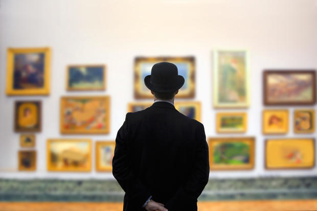 Man wearing Bowler hat in gallery 