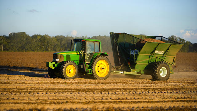 Tractor plowing a field.Not John Deere but Claas tractor 