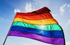 Rainbow LGBTQIA pride flag waving in the wind 