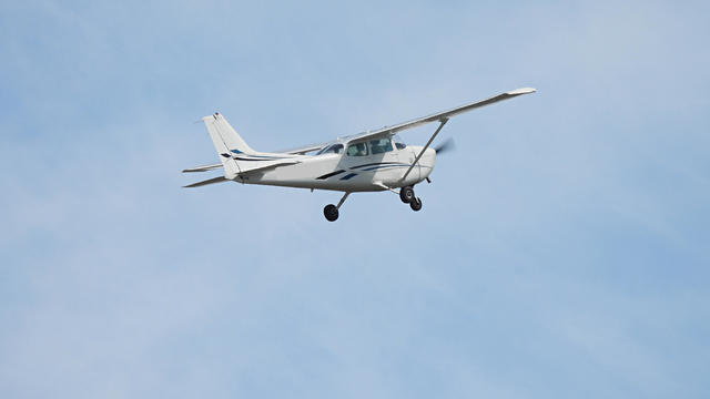 Cessna plane taking off from a small airport 