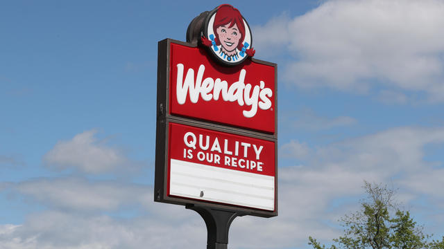 The logo for Wendy's is seen on the sign outside of the fast 