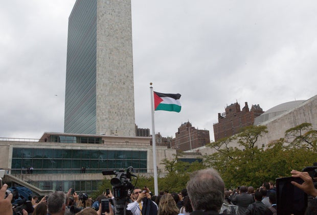 Hundreds of people attended the ceremony to raise the