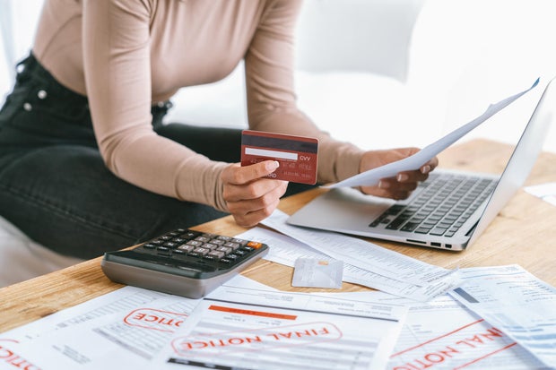 Stressed young woman has financial problems credit card debt to pay crucial