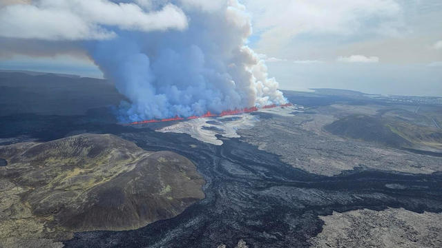A volcano spews lava and smoke as it erupts on Reykjanes Peninsula in Iceland 