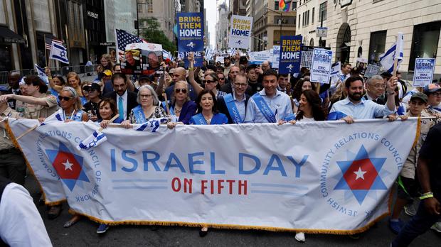 New York Governor Kathy Hochul (C) joins people marching on Fifth Avenue as they participate in the annual Israel Day Parade on June 2, 2024 in New York City. 