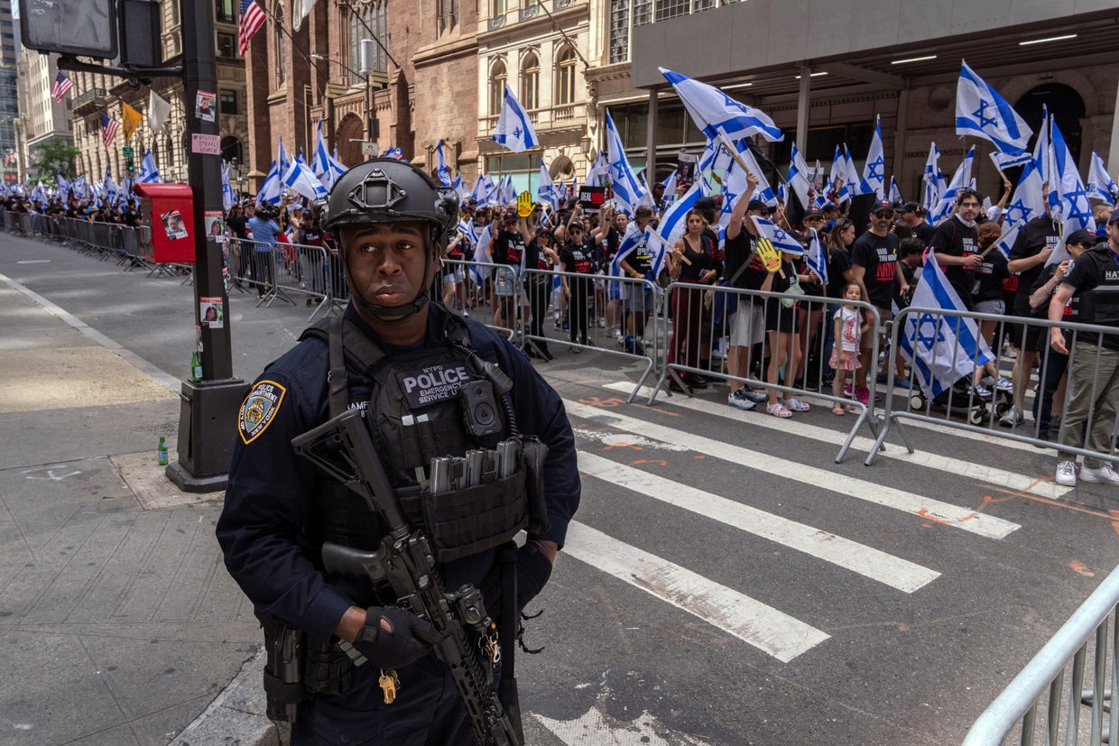 NYPD Emergency Service Unit patrol with rifles at the the Israel Day on Fifth parade on June 2, 2024 in New York City.