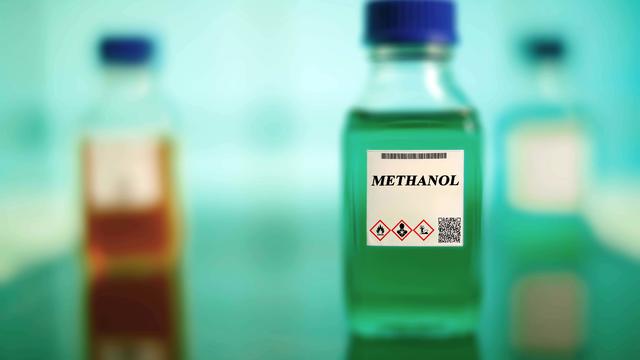 Glass bottle of methanol biofuel 
