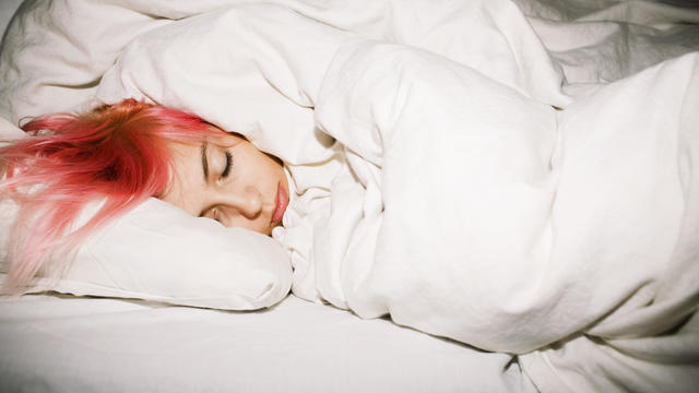 Young woman sleeping, Sweden. 