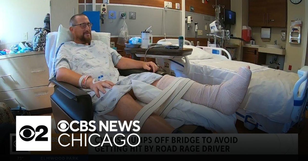 Cyclist jumps off bridge to avoid getting hit by road rage driver - CBS ...