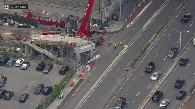 An aerial view of a pedestrian bridge being built along the FDR Drive. 