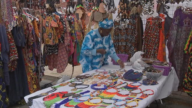 A woman looks at African jewelry during the Odunde Festival in Philadelphia 