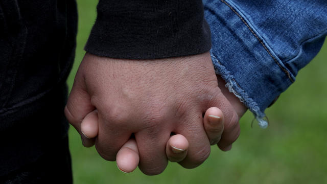 Christian and his wife Monze were laid off from restaurant jobs in mid-March and not qualified to receive unemployment because they are undocumented immigrants seen holding hands on Thursday, April 9, 2020, in San Lorenzo, Calif. 
