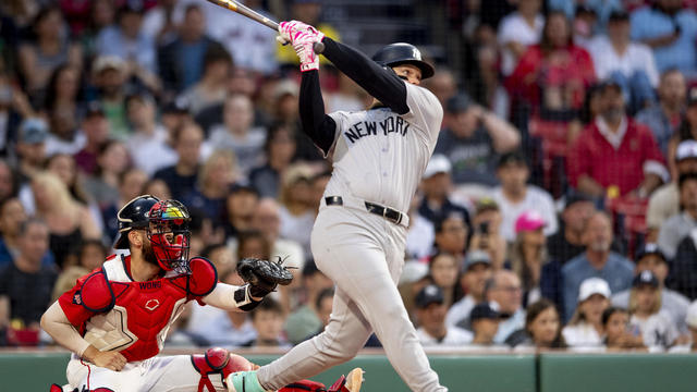 Alex Verdugo #24 of the New York Yankees hits a two-run home run during the first inning of a game against the Boston Red Sox on June 14, 2024 at Fenway Park in Boston, Massachusetts. 