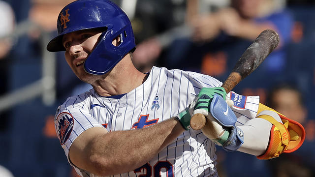 Pete Alonso #20 of the New York Mets hits a 2-run scoring single during the eighth inning against the San Diego Padres at Citi Field on June 16, 2024 in New York City. 