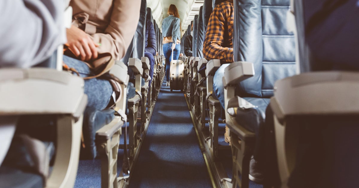 Maryland woman charged after police say she hit child on plane who called her Maryland woman charged after police say she hit child on plane who called her