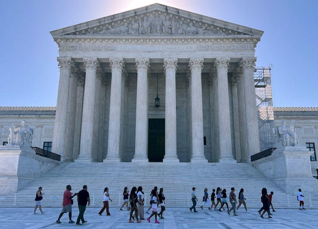 Tourists gather outside the U.S. Supreme Court on June 7, 2024, in Washington, D.C.