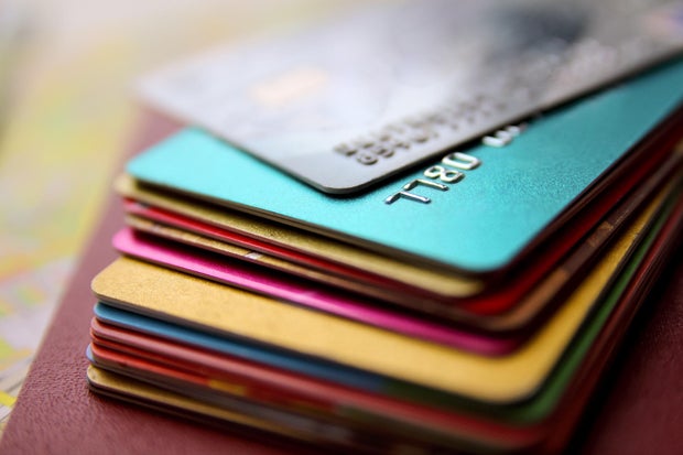 stack of bright colorful discount plastic cards, close up view