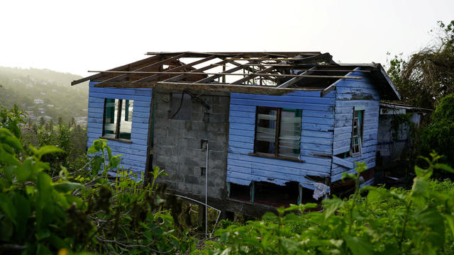 Damaged house missing its roof after Hurricane Beryl passed Grenada 