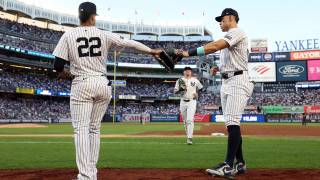 Juan Soto #22 and Aaron Judge #99 of the New York Yankees tap gloves before the fourth inning at Yankee Stadium on July 03, 2024 in the Bronx borough of New York City. 