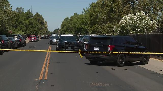 Close Up Shot Focused on Yellow Tape Showing Text Police Line Do Not Cross. Restricted Area of a Crime Scene. Bokeh Background with Flickering Siren Lights. Forensics Team Working on a Case 