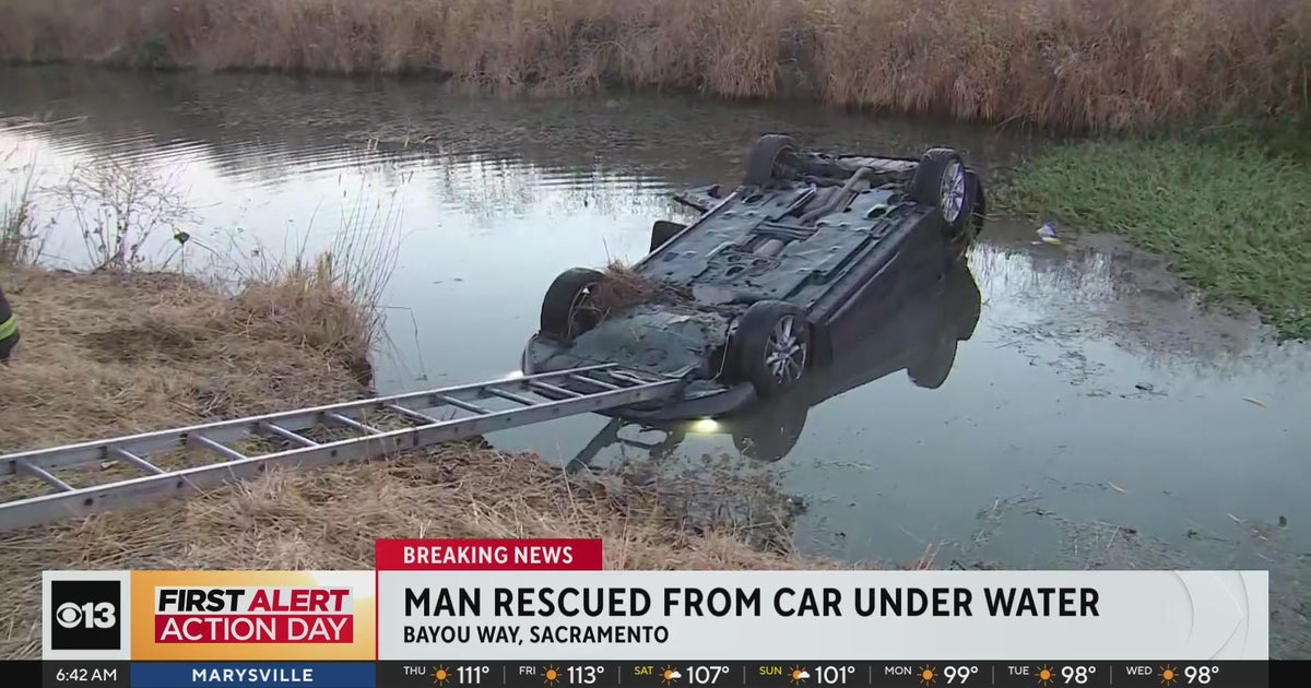 Man rescued from car that crashed into canal