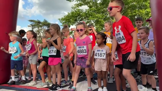 Kids line up at the starting line of a race 