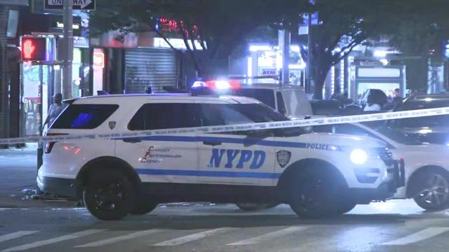 An NYPD vehicle at the intersection of Lenox Avenue and West 135th Street. 