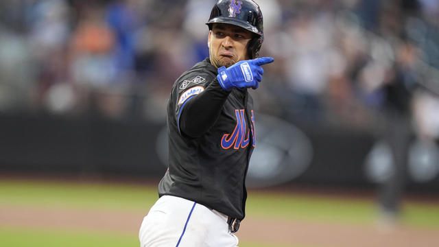 New York Mets' Jose Iglesias gestures to teammates as he runs the bases after hitting a home run during the second inning of a baseball game against the Colorado Rockies, Friday, July 12, 2024, in New York. 