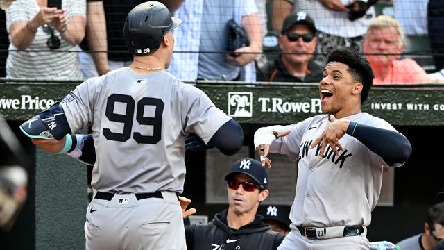 Aaron Judge #99 of the New York Yankees celebrates with Juan Soto #22 after hitting a home run in the fifth inning against the Baltimore Orioles at Oriole Park at Camden Yards on July 13, 2024 in Baltimore, Maryland. 