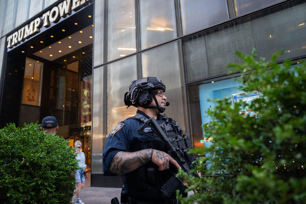Law enforcement stand guard outside of Trump Tower in New York City, after Former President Donald Trump was injured when shots were fired at a rally in Pennsylvania on July 13, 2024. 