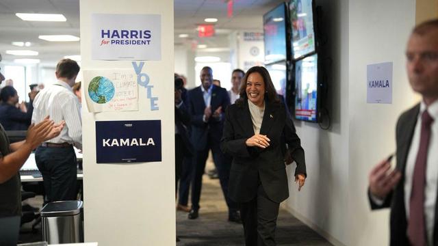 Vice President Kamala Harris arrives at the campaign headquarters in Wilmington, Delaware. Signs say Harris for President, Kamala and Vote. 