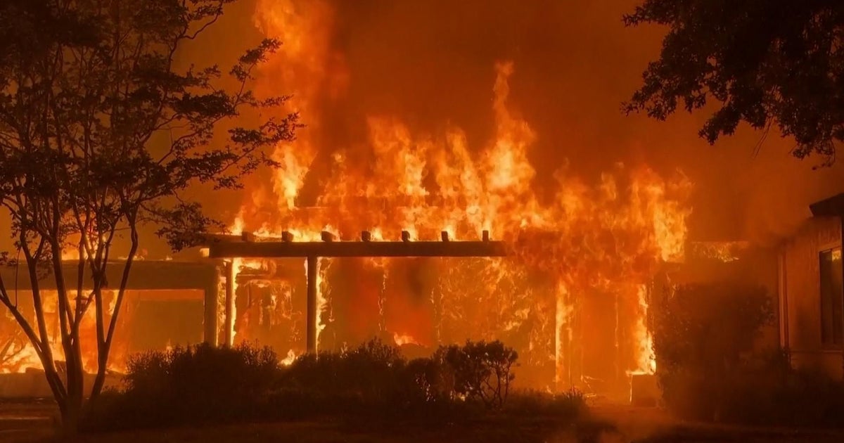 Northern California wildfire explodes in size, arson suspect arrested