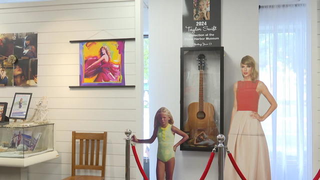 Part of the exhibit at the Stone Harbor Museum, it has a framed guitar and two cutouts of Taylor Swift, one of her as a child, one of her as an adult 