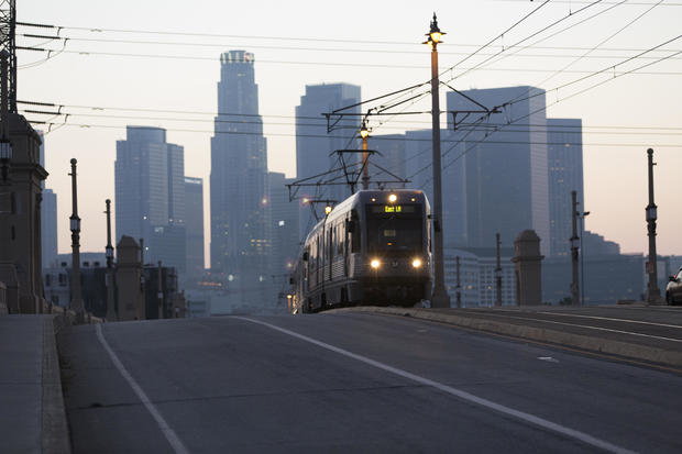 LA Metro train going over bridge in Downtown area 