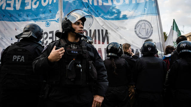 Police surround the protesters during the protest 