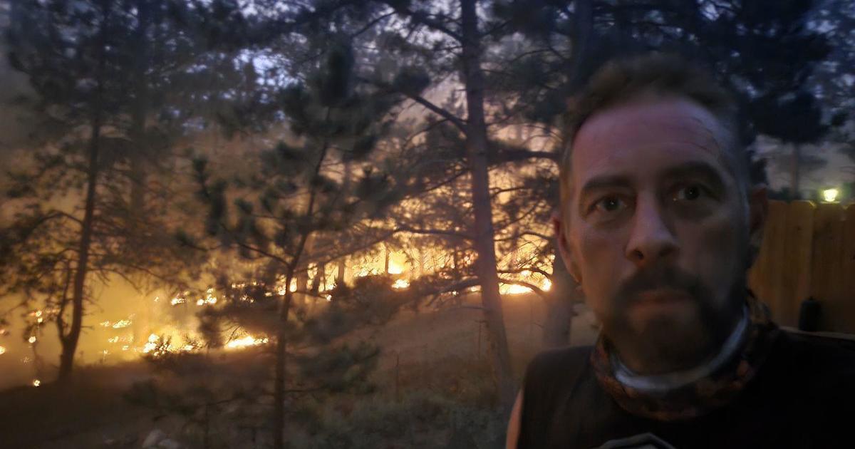 Colorado man continues trying to save his home from wildfire: “It’s a war zone up here”