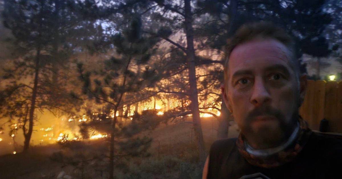 Colorado man continues trying to save his home from wildfire: “It’s a war zone up here” Colorado man continues trying to save his home from wildfire: “It’s a war zone up here”