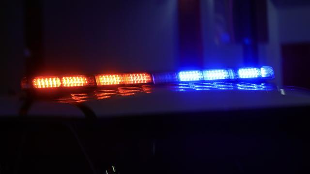 Police car with bright lights and siren 