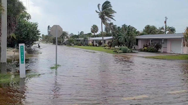 A view of a flooded street due to storm Debby in Holmes Beach, Florida 
