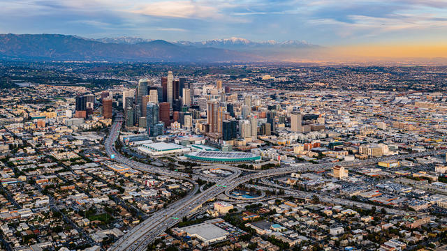 Downtown Los Angeles Snow Peaked Mountains Aerial Sunset 