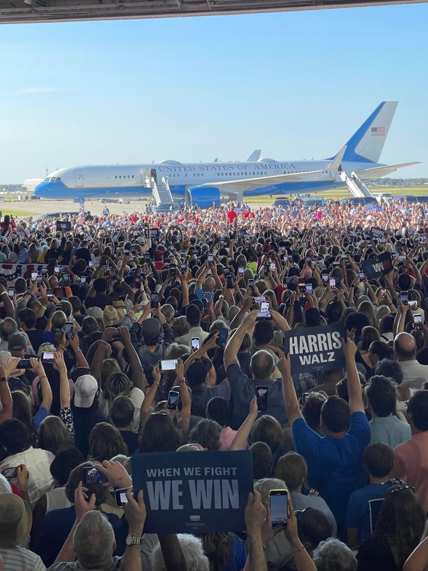 A photo of a crowd waiting for a Harris campaign rally